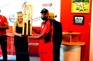 Anja Catrine presenting the 1844 Jodah Trophy to Numan Aslam,Canadian College Cricket, with Lloyd looking on.